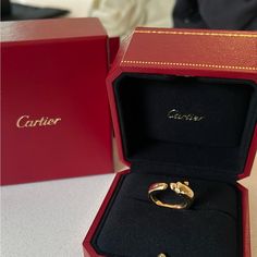 This Authentic Panther Ring Is A Beautiful Yellow Gold 750/1000, Onyx, Set With 2 Tsavorite Garnets. This Ring Has Never Been Worn. Do Not Pass Up On This Amazing Offer. Authenticity Card, Cleaning Kit, Box, And Bag All Included!! Designer 14k Gold Wedding Rings, Cartier Luxury Diamond White Diamond Ring, Cartier Jewelry With Single Round Cut Diamond, Cartier Single Diamond Round Cut Jewelry, Designer Yellow Gold Brilliant Cut Diamond Ring, Designer Yellow Gold Diamond Ring With Brilliant Cut, Luxury Cartier Rings In Diamond White, Luxury Cartier Diamond Ring With Vvs Clarity, Luxury Cartier Diamond Ring