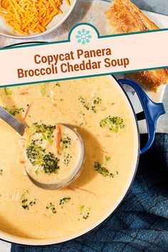 a bowl of broccoli cheddar soup with a spoon in it and cheese on the side