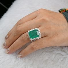 AVERAGE DIAMOND CLARITY SI1-SI2 AND COLOR H-I Emerald Cut Emerald Diamond Ring / 18K Gold Emerald Cocktail Ring / Natural Emerald Gemstone Ring / Wedding Emerald Ring / Halo Ring For Her Details :- Stone :- Diamond / Emerald  Stone Shape :- Octagon / Round  Making : Handmade  Treatment : Natural Item Code:-SER-22580 Gross Weight :- 8.58 gm Approx.  18k Gold Weight :- 5.81 gm Approx.  Diamond Weight :- 1.62 ct. Approx. (Si Clarity Hi Color Certified Diamonds) Emerald Weight :- 12.25 ct. Approx. Diamond Birthday, Octagon Ring, Emerald Halo, Smaragd Ring, Golden Rings, Emerald Wedding Rings, Emerald Diamond Ring, Cocktail Wedding, Zambian Emerald