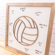 there is a wooden frame with a volleyball on it