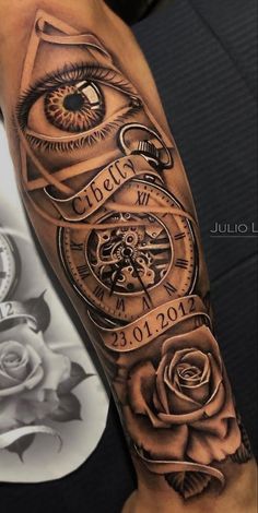 a man's arm with an all seeing eye and rose tattoo design on it