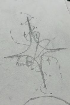 a pencil drawing of a cross on top of a piece of paper