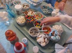 a table topped with lots of different types of candy and candies on top of it