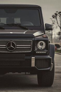 the front end of a black mercedes g - class