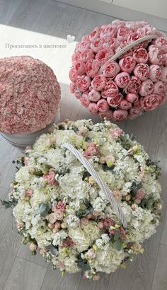 three different types of flowers are arranged on the floor next to each other, including roses and hydrangeas