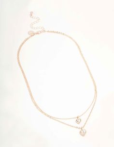 Dazzle with this Rose Gold Diamante Heart Layered Necklace. With its captivating heart pendant, it's perfect for layering or wearing solo for that head-turning glamour. A must-have accessory for any outfit. Material: Crystal Dimensions: Chain Length: 45 cm Extender: 8 cm Feature Dimensions: Pendant Width 9 mm x Pendant Height 14 mm | Lovisa Rose Gold Diamante Heart Layered Necklace, Clear Layered Necklace, Chain Lengths, Layered Necklaces, Chain Length, Heart Pendant, Turning, Layering, Rose Gold, Chain