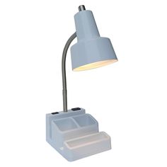 a desk lamp that is on top of a white box with a light in it