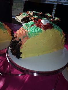 there is a cake that has been cut and served on the table for people to eat