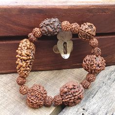 📿This unique bracelet is made from genuine sacred seeds of 2- 7 Mukhi Rudraksha. Wear this wrist seed bracelet to reap its amazing benefits.📿 2 Mukhi Rudraksha - It is also beneficial for those who are in search of the best life partner. It also helps to bring pleasure and spiritual gains to the wearer life. 3 Mukhi Rudraksha - Three Mukhi rudraksha has a soothing effect on one's mind and body. Three Mukhi Rudraksha is the form of three types of Agni (fire) and also the symbol of Three Deva i. Best Life Partner, Baby Dedication Gifts, Seed Bracelet, Rudraksha Bracelet, Peridot Bracelet, Sea Glass Bracelet, Beads Mala, Tiger Eye Jewelry, Black Beaded Bracelets