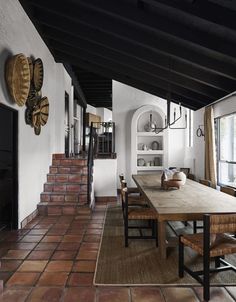 a dining room table and some chairs in a room