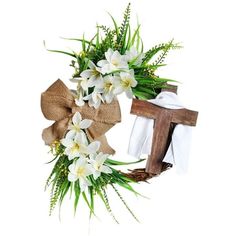 a wreath with white flowers and a cross