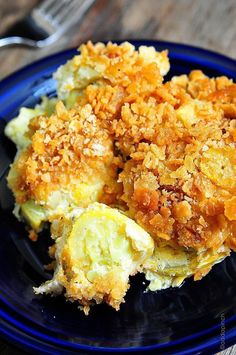 a close up of a plate of food with broccoli and bread crumbs