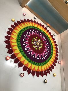 a colorful flower design is on the floor