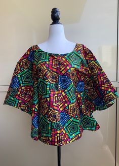 Stylish Handmade Ankara Peplum Tops/Blouses  This Peplum top suits every occasion for whatever you decide to wear it with, whether you add pants or a skirt with it, you will definitely feel like the luckiest and pretty  girl in the world. Bring on that charm!  KINDLY NOTE:  Fabric colors may vary slightly due to light and electronic setting. I have tried my best to reflect natural  and true colors  of the fabric but it may appear slightly different due to the varied representation of colors on e Spring Festive Blouse With Set-in Sleeves, Festive Spring Blouse With Set-in Sleeves, Fitted Green Printed Blouse, Colorful Short Sleeve Cotton Blouse, Festive Tops With Set-in Sleeves, Green Short Sleeve Blouse With Vibrant Print, Multicolor Summer Blouse For Festive Occasions, Summer Festive Multicolor Blouse, Spring Festive Printed Blouse