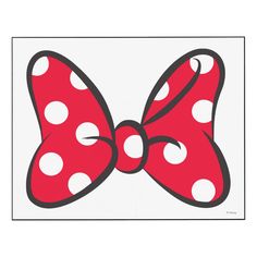 a red bow with white polka dots on it