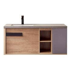 a bathroom vanity with drawers and a sink on the top, in light wood finish