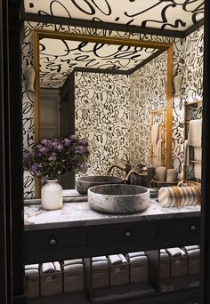 a bathroom with a sink and mirror in it