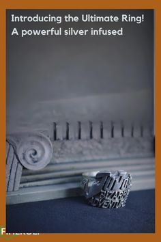 a silver ring sitting on top of a window sill next to a radiator