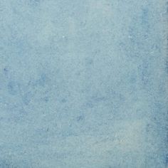 an old blue paper textured with white paint