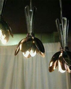 three lights that are hanging from the ceiling