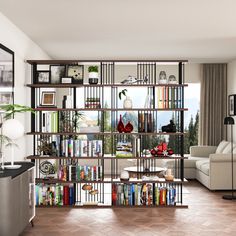 a living room filled with lots of furniture and bookshelves next to a window