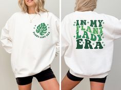 In My Plant Lady Era Sweatshirt, Plant Mom Sweater, Plant Mom Gift, Crazy Plant Lover Gift, Gardening Shirt for Women 🌺How To Order🌺 -Please, check and review all photos -Choose your t-shirt color and size -Choose your design/text color -Choose Your Quantity 🔴Please make sure you choose the right product.  Unisex = T-Shirt Women's Cropped = Cropped Shirt Women Racerback Tank= Women Tank Top Sweatshirt = Without hood Crewneck Long Sleeve = Same as shirt material but long sleeve version Hodie = With hoodie and pockets -If you want to add or change anything on the existing design that we show in the display picture, please contact with the seller from message box to ask if the changes and additional request can be done or not, if you do not ask and request for it without asking in the orde Gardening Shirt, Sassy Tee, Girl Material, My Plant, Mom Sweater, Gardening Shirts, Design Text, Plant Lover Gift, Display Picture