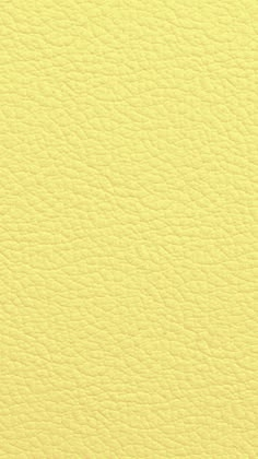 a yellow leather texture background that looks like it has been used as a wallpaper