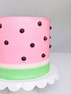 a watermelon cake with chocolate chips on top