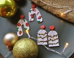 some christmas decorations are on a plate next to a bauble ornament