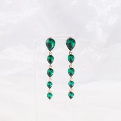 Get a feel for luxury in these flowing teardrop earrings that creates balance in your style. Size: - Length: 2.75 in (6.99 cm) x Width: 0.38 in 0.97 cm) Quality: - Multi-sized teardrop cut rhinestones and metal alloy backing to create a 5-tiered drop earring connected by links with a post backing. Imported Bridal Party Jewelry, Dress Blouse, Wedding Bridal Party, Off The Shoulder Dress, Drop Earring, White Tee, Teardrop Earrings, Formal Event, Wedding Bridal