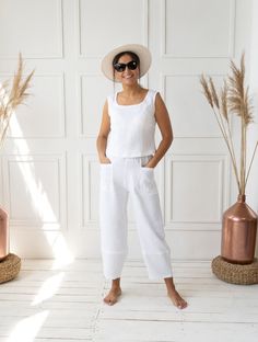 "High waist linen pants are perfect for everyday looks and occasions.  This LiMi Style pants are hand-made from soft linen to keep you comfy in warm weather.  PRODUCT FEATURES:  - Handmade with love. - 100% soft natural linen. Breathable and comfortable.  - Elastic waist. - Cropped length. - The front pockets are patched with dart motifs. - A high hem at the bottom of the leg on the back and front accentuates the amphora effect of the garment. COLOR: - White, you can also choose other colors above. SIZING & FIT: - The length of the pants is from the waist to the bottom:     - S (34) - 92 cm / 36.2\" (172 cm / 5'6\" tall).     - S/M (36) - 92 cm / 36.2\" (172 cm / 5'6\" tall).     - M (38) - 93 cm / 36.6\" (172 cm / 5'6\" tall).     - M/L (40) - 94 cm / 37\" (172 cm / 5'6\" tall).     - L ( White Linen Cropped Pants, Linen Ankle Pants, White Linen Trousers, White Crop Pants, Trousers Casual, Cropped Linen Pants, Pants Summer, Style Pants, Linen Trousers