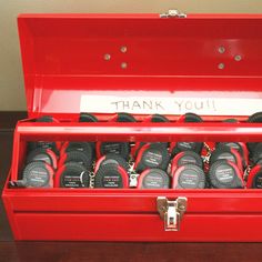 a red toolbox filled with lots of black and red items that say thank you