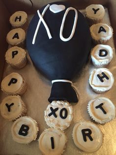 a birthday cake with cupcakes in the shape of letters