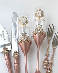 there are five different types of utensils on the table, including one with a monogram