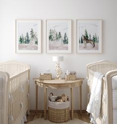 a baby's room with two cribs and three pictures on the wall