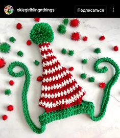 a knitted christmas hat sitting on top of a table