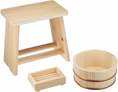 a wooden stool, bowl and tray with one sitting on the floor