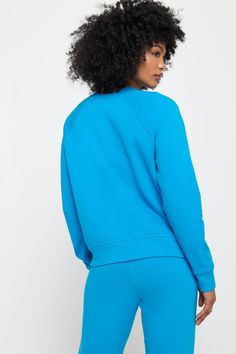 When your Crew Neck feels this good, you'll find any excuse to throw it on. Meet the Hamsa Forever Crew, a relaxed-fit layer equally ready for post-workout or the main event. Softness like no other Classic crew neck and raglan sleeve Relaxed fit with room to move Elevated rib edge detail Puff printed Hamsa graphic | Hamsa Forever Crew in Azul Relaxed Fit Activewear For Spring, Relaxed Activewear For Spring, Spring Relaxed Activewear For Workout, Relaxed Spring Activewear For Workout, Relaxed Spring Workout Activewear, Cotton Yoga Activewear, Sporty Moisture-wicking Sweatshirt For Workout, Sporty Sweats With Ribbed Cuffs, Sporty Sweats With Ribbed Cuffs For Workout