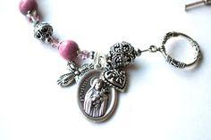 "Searching for a meaningful, one of a kind gift? My Saint Therese Lisieux genuine rhodonite rosary bracelet with beautifully written and illustrated 24 page novena booklet (pictured) might be just what you were looking for! What a special way for you or your loved one to witness their faith as well as having a treasured rosary to pray with anytime! Handcrafted with care, the rosary bracelet measures 6 3/4 inches plus toggle clasp and is designed with quality rhodonite semi precious gemstones alt Handmade Adjustable Rosary Bracelet For Weddings, Spiritual Nickel-free Charm Bracelet As Gift, Spiritual Nickel-free Charm Bracelet For Gifts, Nickel-free Spiritual Charm Bracelet As A Gift, Spiritual Bracelets With Miraculous Medal As Gift, Spiritual Beaded Bracelets With Miraculous Medal, Nickel-free Spiritual Rosary Bracelet Gift, Elegant Rosary Bracelet With Miraculous Medal Gift, Elegant Rosary Bracelet With Miraculous Medal