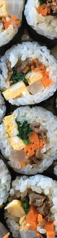 several pieces of sushi with various toppings arranged on top of eachother