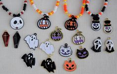 a collection of halloween themed necklaces on a table