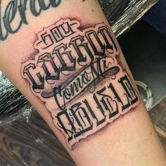 a tattoo on the leg with words written in cursive writing and black ink