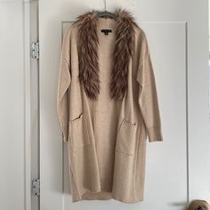 Never Worn, Perfect Condition. Color: Light Tan Size: X-Small But Could Also Fit A Small. Chic Cardigan With Faux Fur Trim For Fall, Chic Faux Fur Trim Cardigan For Fall, Fall Cardigan With Faux Fur Trim For Cold Weather, Chic Fall Cardigan With Faux Fur Trim, Cream Long Sleeve Outerwear With Faux Fur Trim, Brown Long Sleeve Outerwear With Faux Fur Trim, Cozy Mink-colored Outerwear With Faux Fur Lining, Faux Fur Cardigan, Fur Cardigan