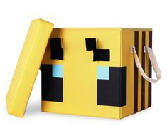 a yellow box with some black squares on it and a white strap around the neck