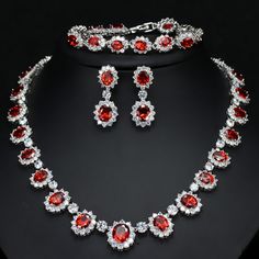 Complete your prom or wedding party look with this stunning Bridal Jewelry Set. The set includes a necklace and earrings, perfect for adding a touch of elegance and sparkle to your special occasion. 
– This bridal a plus cubic zirconia gemstone necklace set is perfect for adding elegance to any bridal ensemble.– Made with high-quality materials, this set includes a stunning necklace and matching earrings for a complete look.– Perfect for pageant, bridal, bridesmaid, prom, quinceañera or special Red Choker Necklace, Africa Dress, Silver Diamond Necklace, Party Necklace, Wedding Party Jewelry, Cubic Zirconia Jewelry, Red Necklace, Fashion Jewelry Sets, Royal Jewels