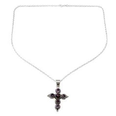 Rich with Indian stylizations this sterling silver cross necklace captivates with a harmonious alignment of gemstones. Neeru Goel presents a beautiful cross necklace centered by a purple composite turquoise and studded with glowing amethyst. Spiritual Cross-shaped Gemstone Necklace, Spiritual Cross Shaped Gemstone Necklace, Sterling Silver Cross Necklace With Gemstone, Purple Amethyst Cross Jewelry, Purple Amethyst Cross Necklace, Silver Cross Gemstone Necklace, Silver Cross Necklace With Gemstone, Silver Gemstone Cross Necklace, Silver Cross Necklace