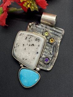 "ARTISAN TURQUOISE DRUZY PENDANT Hand-made Sterling Silver. Stones used: Druzy, Turquoise, Peridot, Amethyst, Citrine Height - 68mm, Width - 40mm. Unique Handcrafted One-of a-kind Design Pendant Each Piece of Jewelry in my Collection is Absolutely One of a Kind! When you start wearing a piece of my jewelry you will fall in love with it more and more each day and feel that good Energy and Love that I pass into it while creating this piece of Art. A piece of Art created for you to be inspired and Good Energy, Piece Of Me, Turquoise Pendant, Be Inspired, My Collection, Artisan Jewelry, Gemstone Pendant, Druzy, Jewelry Gift