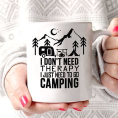 a woman holding a coffee mug in her hands with the words i don't need the rappy i just need to go camping