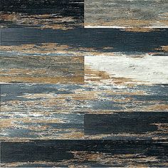 an abstract painting with different shades of blue, brown and white paint on the floor