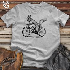 Be the coolest critter around in this 100% cotton, ultra-soft Bella Canvas squirrel on a bike t-shirt! Show off your love of animals with this one-of-a-kind tee! The perfect gift for any animal lover. Made from high-quality cotton for maximum comfort and durability. Get your squirrel on a bike tee today! Jocko Willink, Boots Jeans, And So The Adventure Begins, Get Yours Now, Modern Fit, Full Sleeve, Pet Clothes, Unique Fashion, Half Sleeves